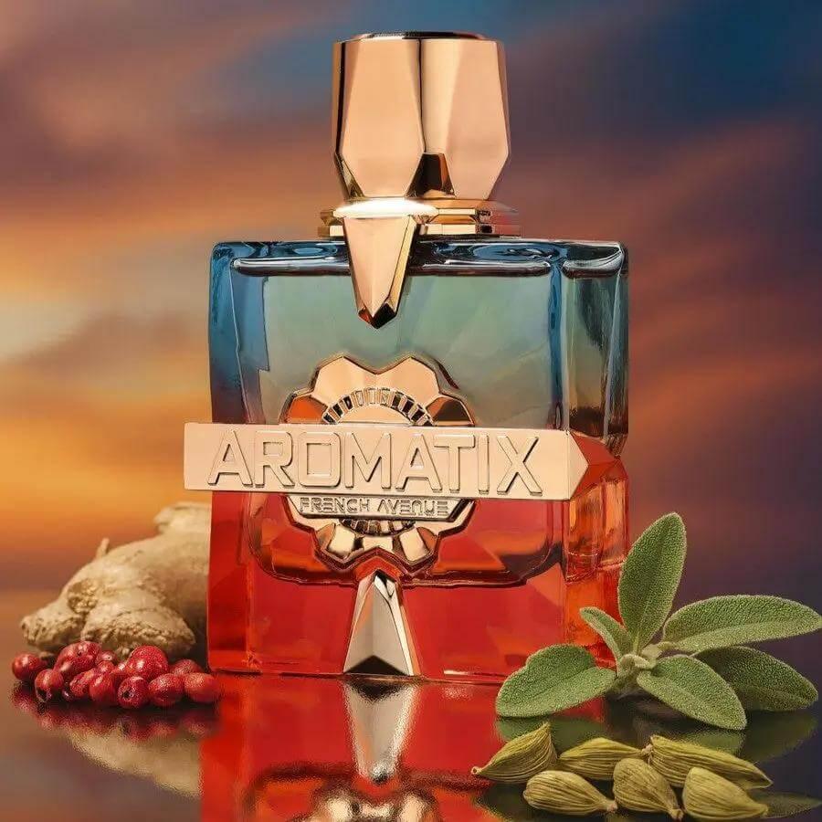 Luxusparfumflakon Aromatix vor Sonnenuntergang, umgeben von Kardamom, Salbei und Ingwer