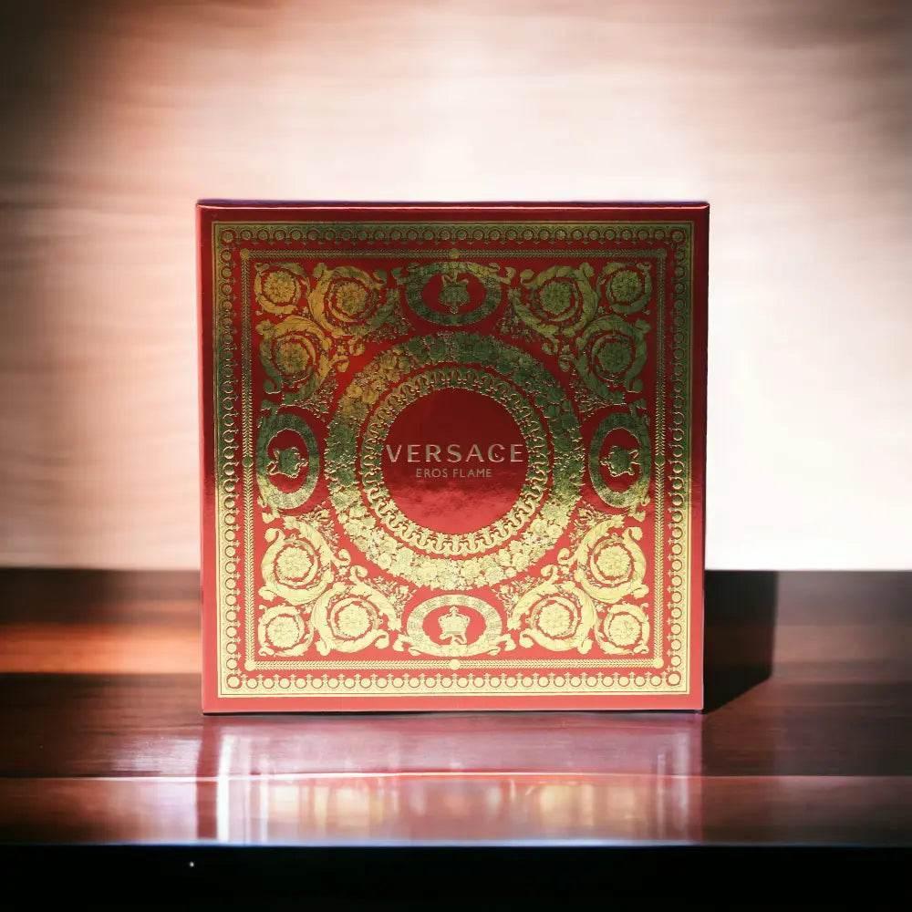 Rote Geschenkbox mit goldenen Ornamenten und Schriftzug Eros Flame fĂŒr Duftset