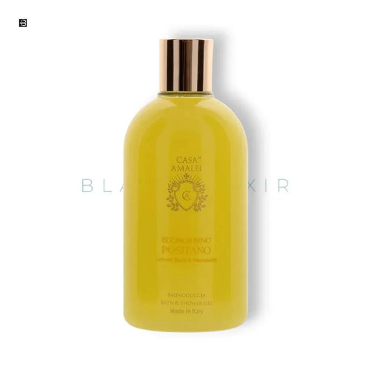 Gelbe Luxus Duschgel-Flasche mit goldfarbenem Deckel, CASA AMALFI Aufschrift, auf weißem Hintergrund