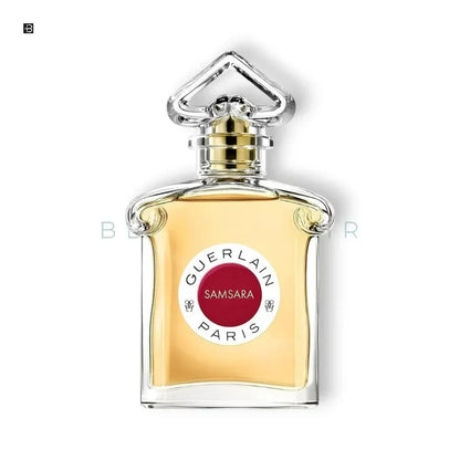 Eleganter Damenparfumflakon mit goldener Flüssigkeit, Etikett 'Guerlain Samsara Paris'.