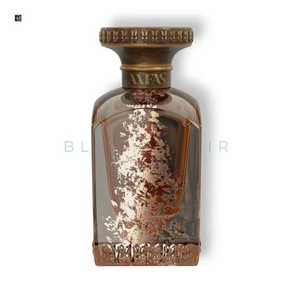 Luxuriöses Parfumflakon aus Glas mit bronzefarbenen Details und dekorativen Goldakzenten
