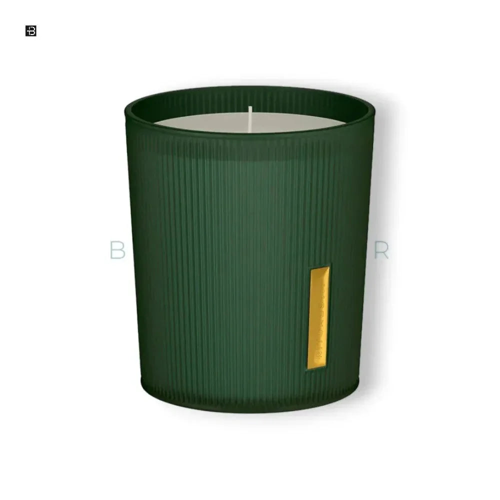 Luxus Duftkerze in grünem Glas mit goldenen Akzent, edles Wohnaccessoire