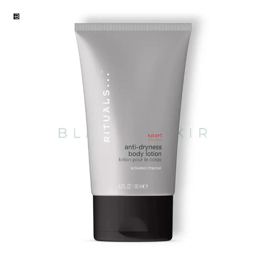 Graue Tube Rituals Sport Anti-Dryness Body Lotion mit Aktivkohle, 100 ml, auf weißem Hintergrund