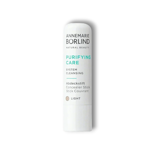 Annemarie Börlind Purifying Care Abdeckstift Concealer Stick Light auf schwarzem Hintergrund
