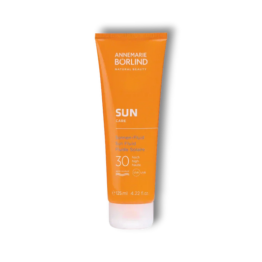 Orange Tube Annemarie Börlind Sun Care Sonnen-Fluid LSF 30, 125 ml, auf schwarzem Hintergrund