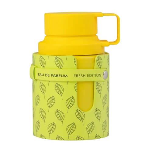 Gelbe Parfumflasche mit Blattmuster und Aufschrift Eau de Parfum Fresh Edition