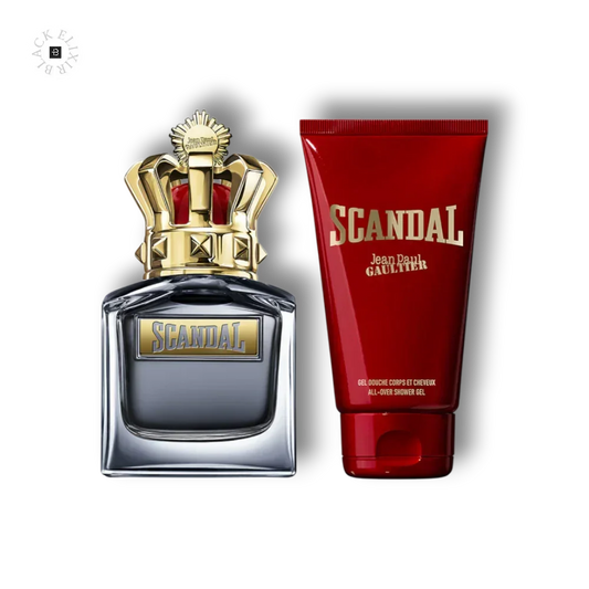 Scandal Parfumflakon mit goldener Krone und passendes rotes Duschgel auf schwarzem Hintergrund