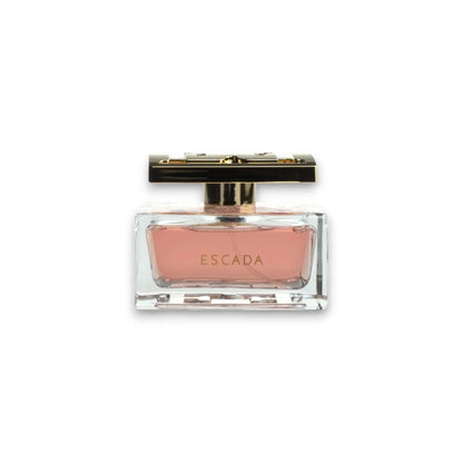 Elegantes Damenparfum in rechteckigem Glasflakon mit rosafarbenem Duft und goldener Kappe