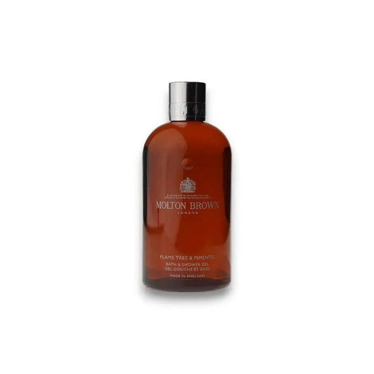 Braune Molton Brown Duschgel-Flasche Flame Tree & Pimento mit silbernem Deckel auf weißem Hintergrund