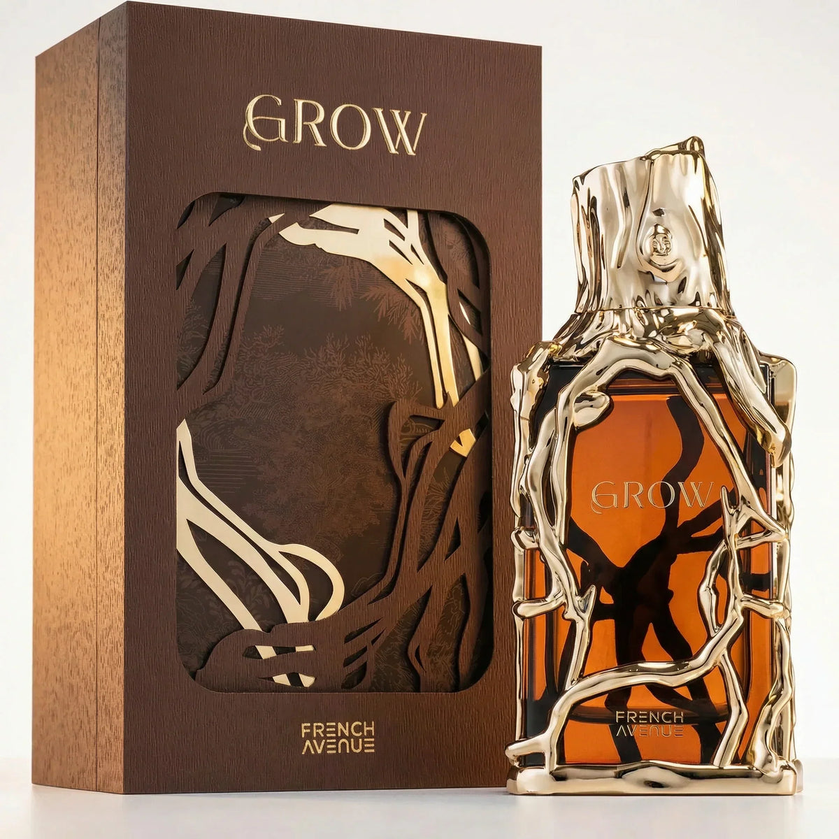 French Avenue Grow Extrait de Parfum: Goldener Flakon in Ast-Optik mit brauner Verpackung.