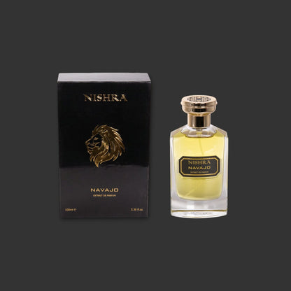Nishra Navajo Parfumflakon und schwarze Box mit goldener Löwenkopf-Verzierung auf dunklem Hintergrund