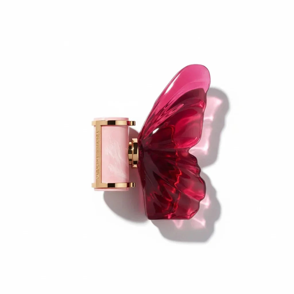 Carolina Herrera La Bomba Eau de Parfum Flakon in Form eines roten Schmetterlings.