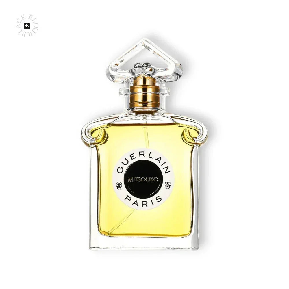Luxuriöses Eau de Parfum in elegantem Glasflakon mit goldener Flüssigkeit, Aufschrift Mitsouko.