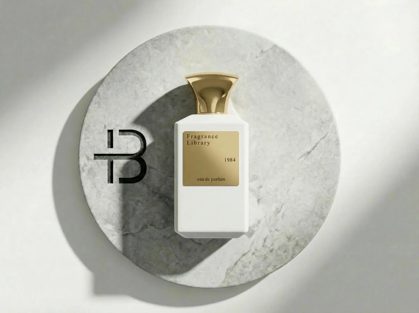 Luxus Parfumflakon Fragrance Library 1984 mit goldener Kappe auf Marmorplatte