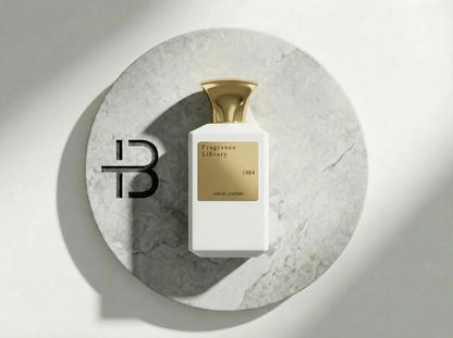 Luxus Parfumflakon Fragrance Library 1984 mit goldener Kappe auf Marmorplatte