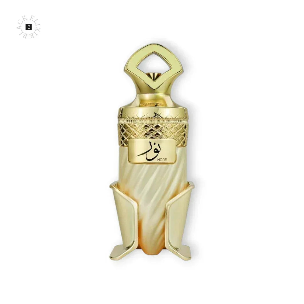 Luxuriöses Parfumflakon in Gold und Perlmutt mit arabischer Aufschrift, dekorativ und edel.