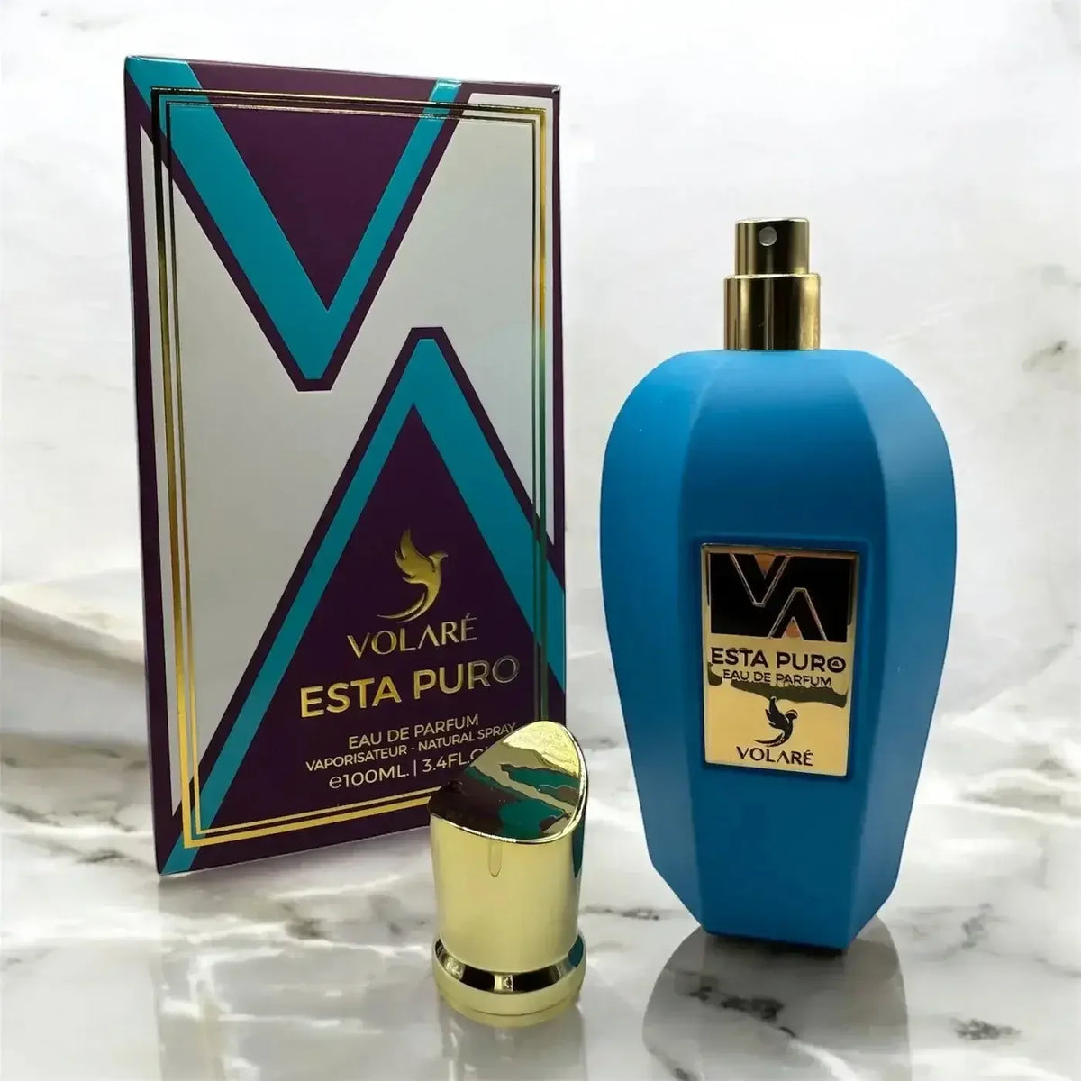 Volaré Esta Puro Eau de Parfum, blaue Luxus-Parfümflasche mit goldener Kappe und Verpackung.